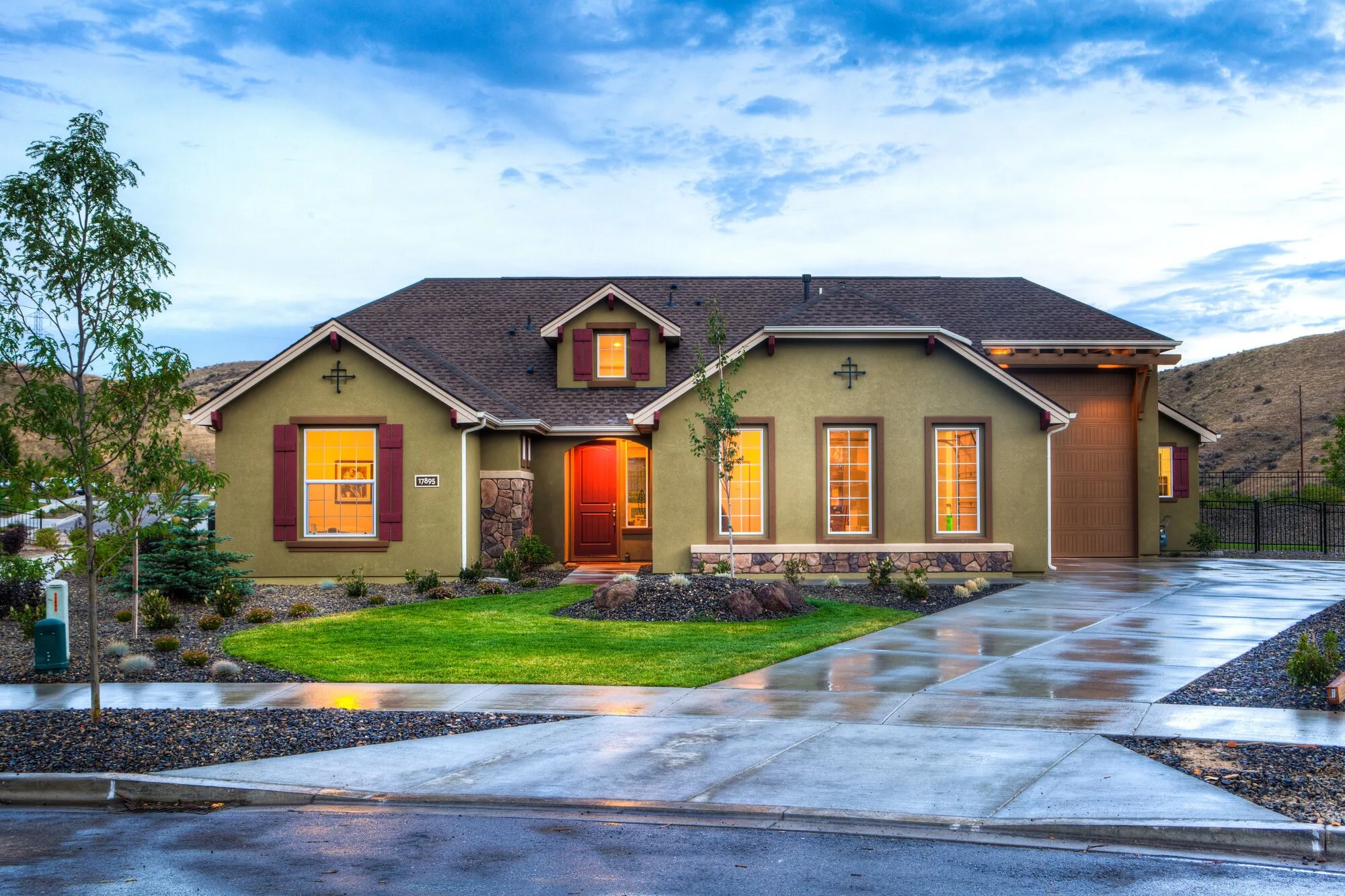 House exterior and driveway at dusk
